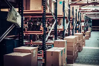 Inside Aliança’s warehouse in Rio Grande, with boxes and shelves.