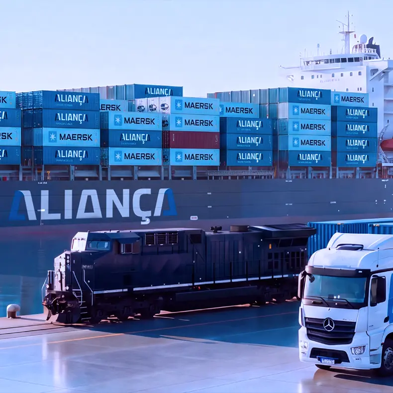 Aliança container ship in port, with a locomotive and an Aliança truck loaded with containers on the quay.